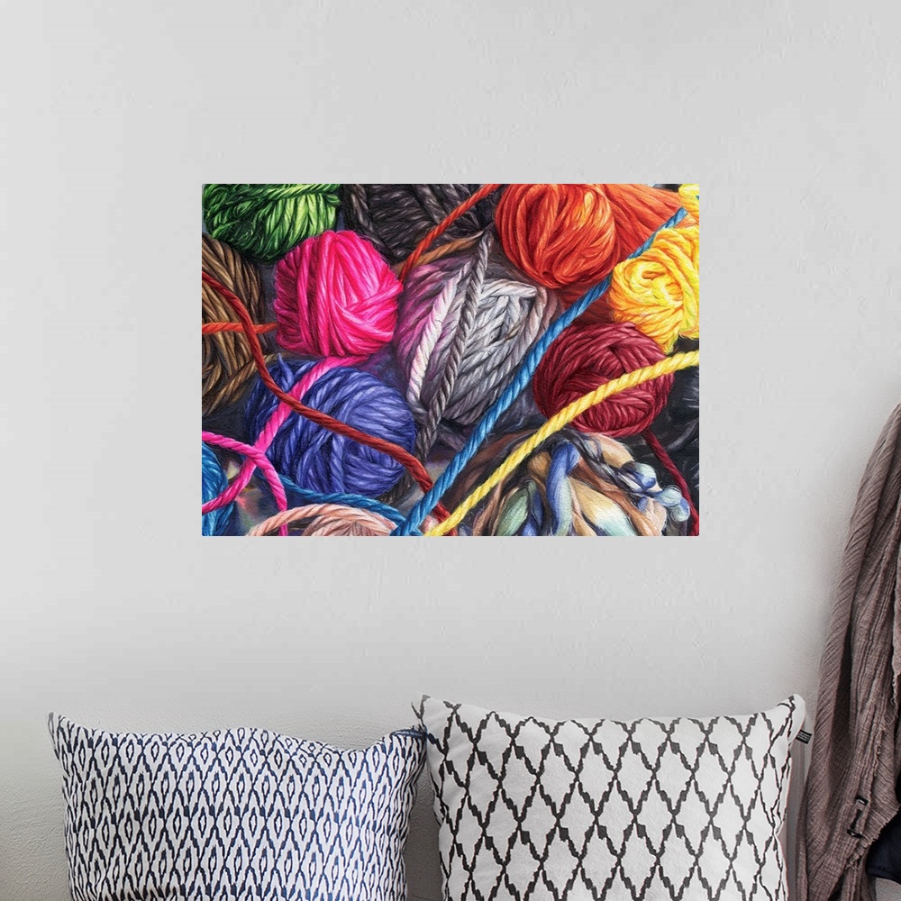 A bohemian room featuring A horizontal watercolor of a bunch of balls of yarn in a variety of colors.