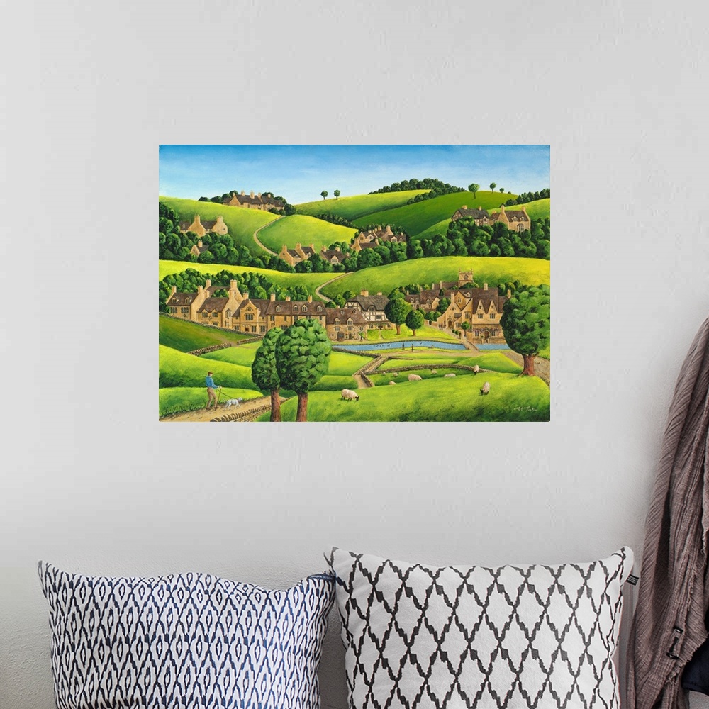 A bohemian room featuring Artwork of a small village nestled in the hills of England.