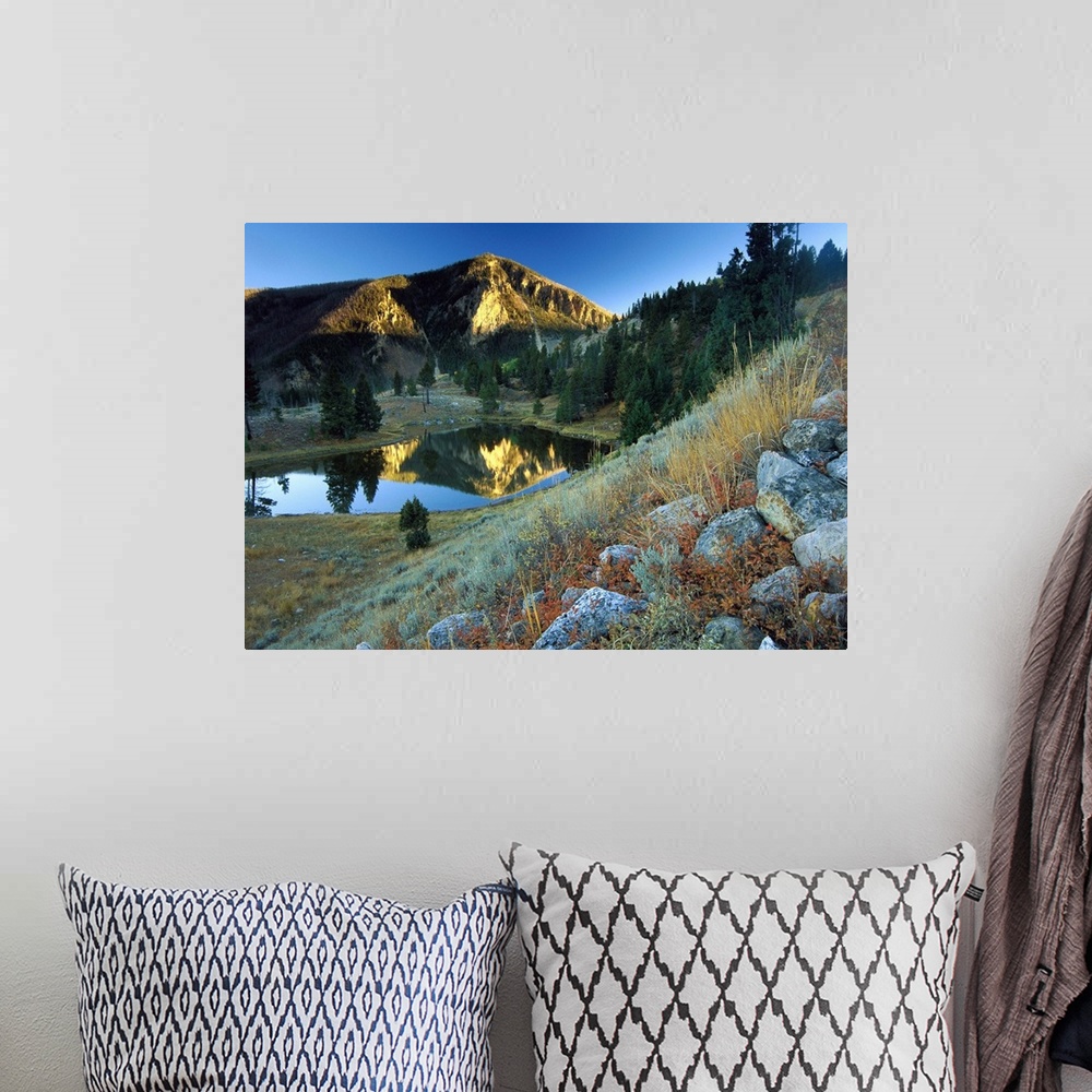 A bohemian room featuring Bunsen Peak reflected in lake, near Mammoth, Yellowstone National Park, Wyoming