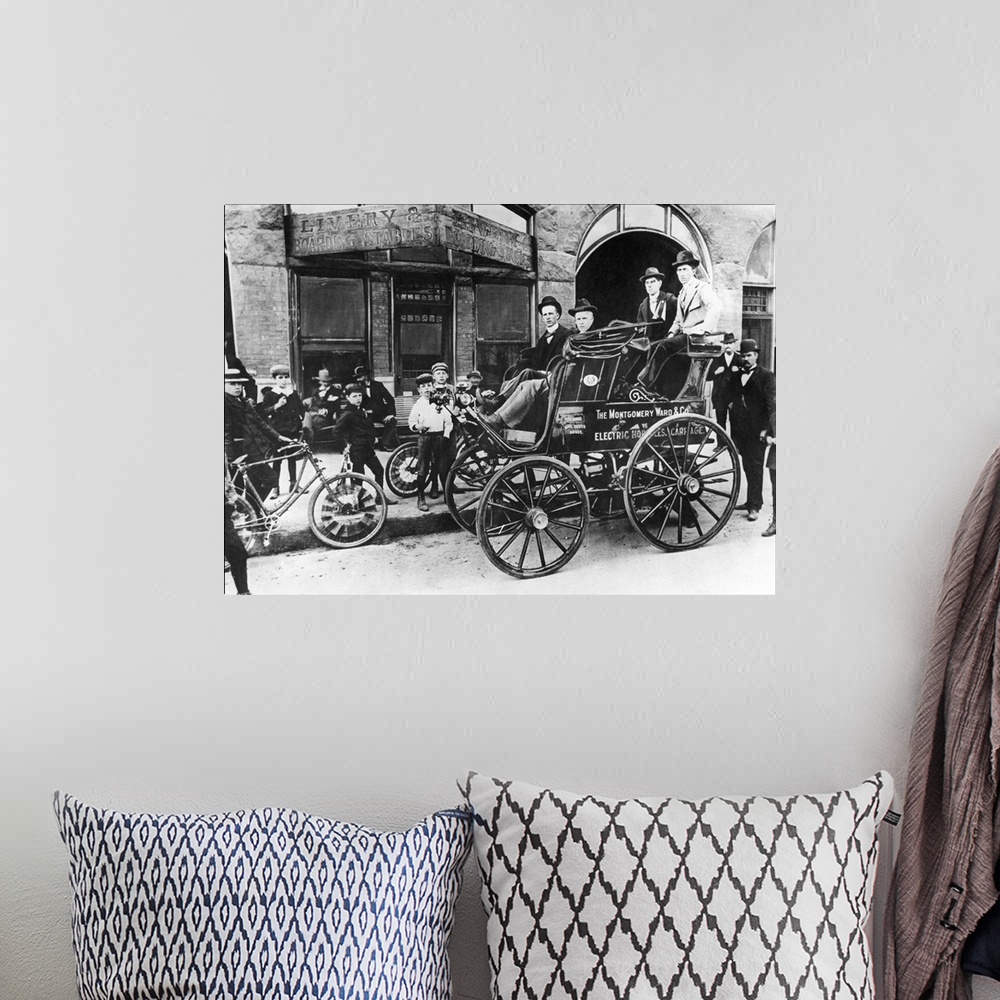 A bohemian room featuring Montgomery Ward's 'Horseless Carriage,' which toured the United States in 1897 as an advertisemen...