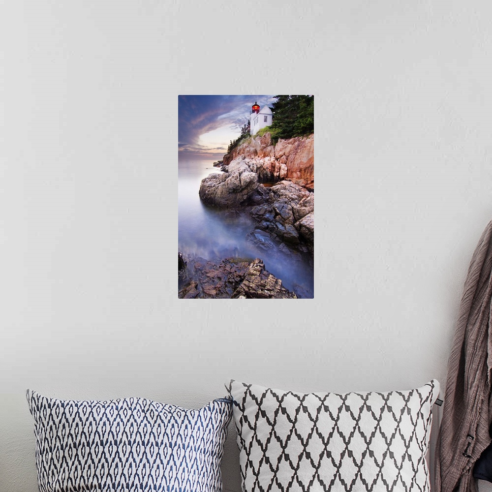 A bohemian room featuring Bass Harbor Lighthouse on the edge of a rocky cliff on the coast of Acadia National Park, Maine.