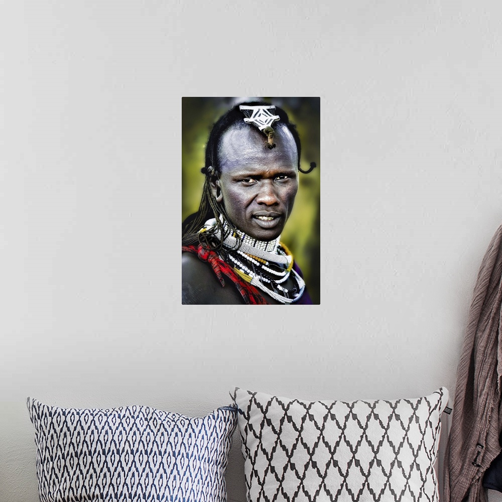 A bohemian room featuring A man wearing decorative jewelry and headpieces in the Masai Mara area of Tanzania.