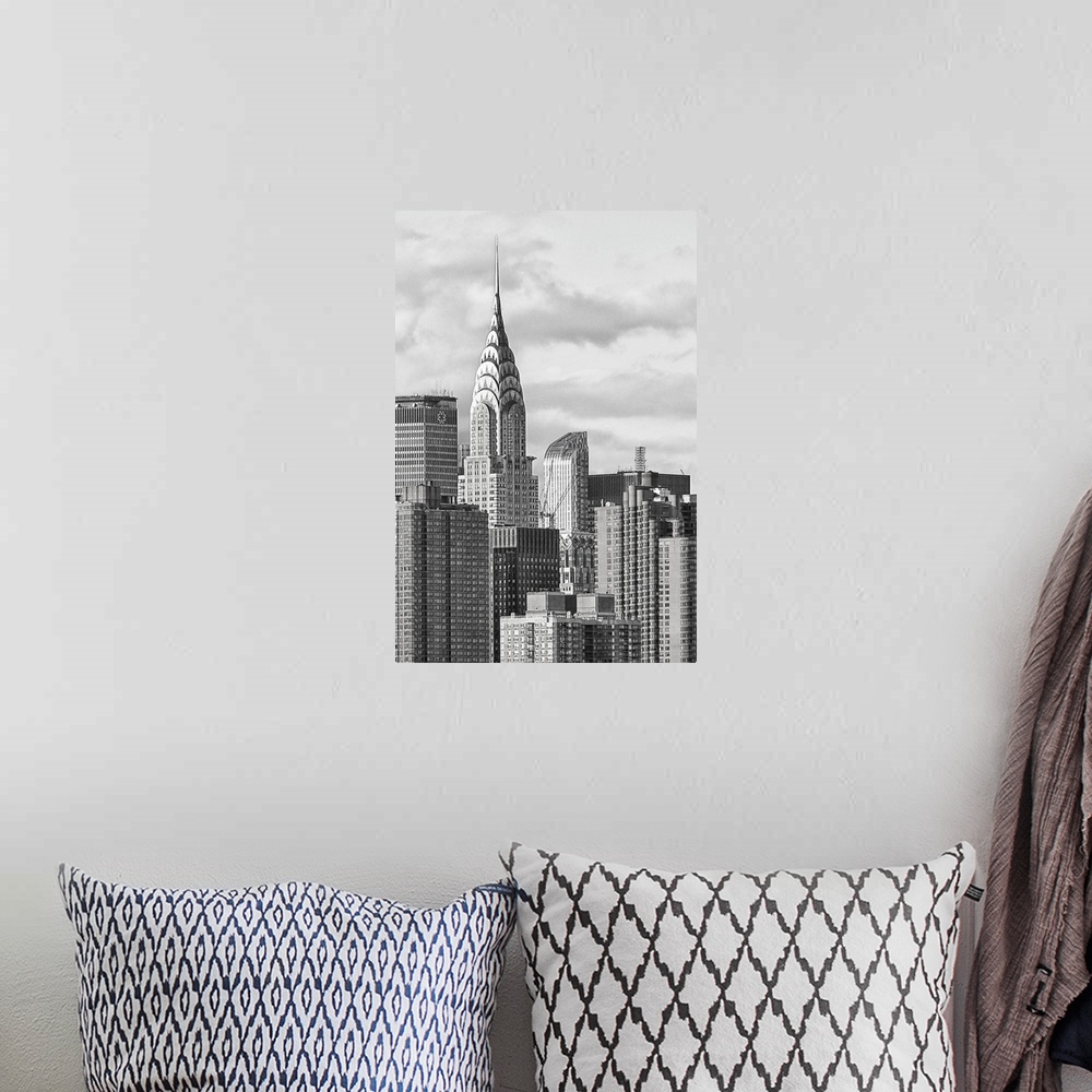 A bohemian room featuring Black and white photograph of the New York City skyline. With the Chrysler building prominently s...