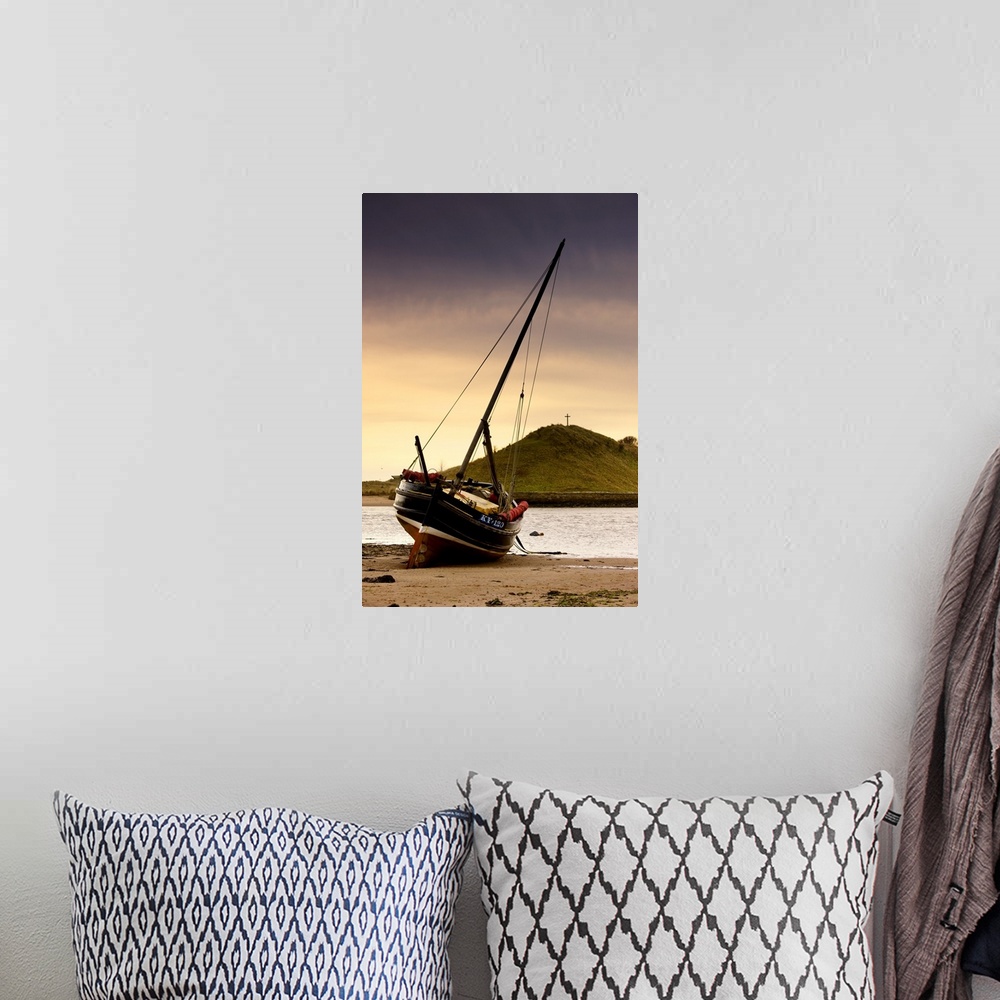 A bohemian room featuring Boat On Beach At Low Tide; Alnmouth, Northumberland, England
