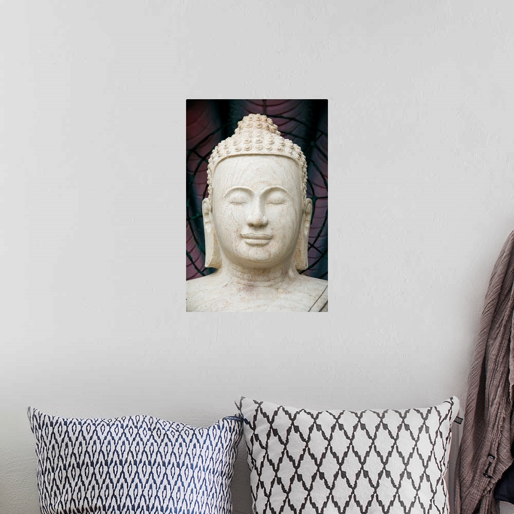 A bohemian room featuring Buddha statue.
