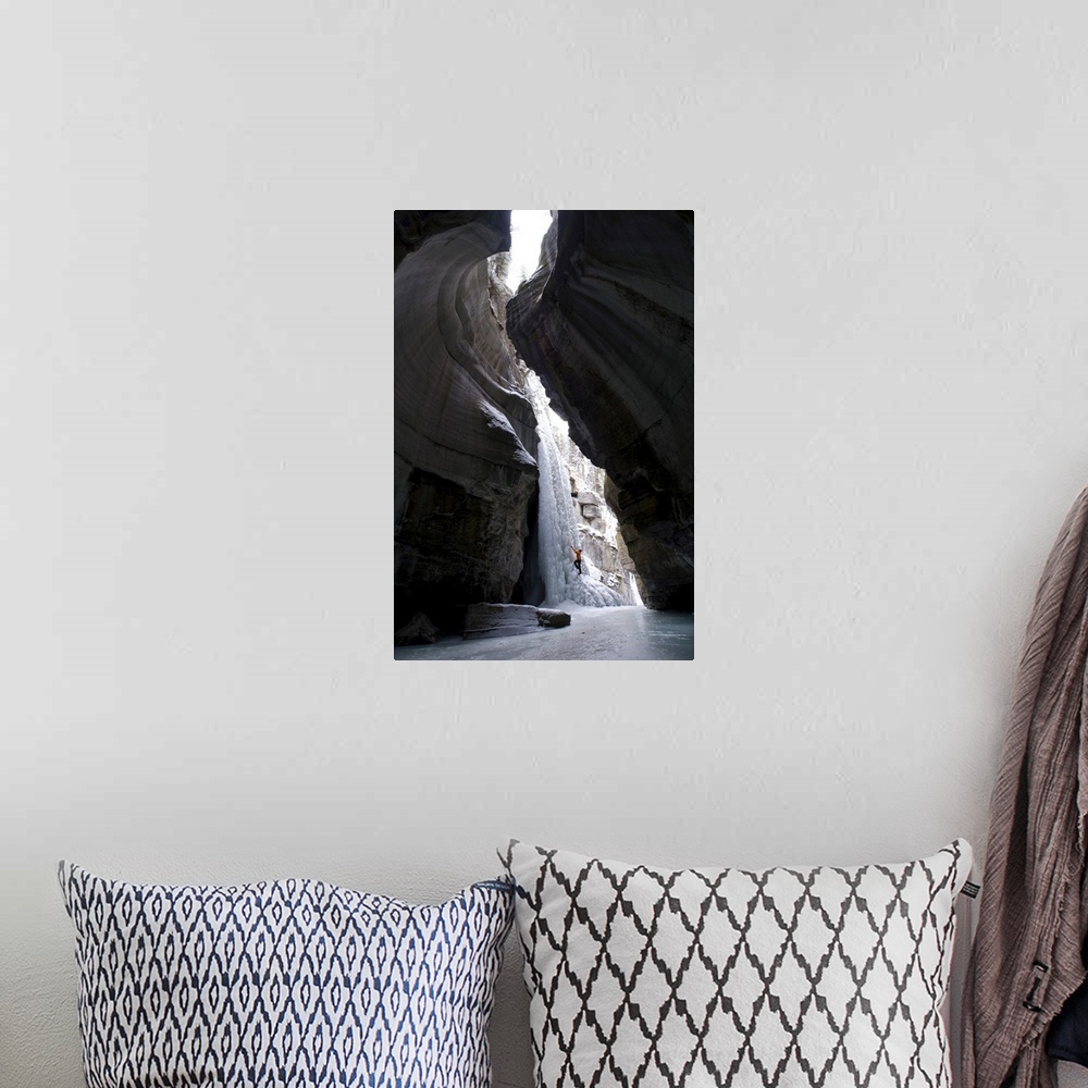 A bohemian room featuring Female Climber Explores Ice Climbing In The Narrows Of Maligne Canyon In Jasper National Park, Al...