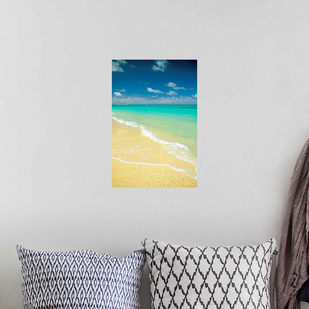 A bohemian room featuring Vertical photo on canvas of crystal clear waves washing up on shore of a beach.