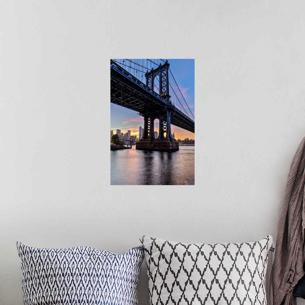 A bohemian room featuring Manhattan Bridge and NYC skyline at sunset, Brooklyn Bridge Park; Brooklyn, New York, United Stat...