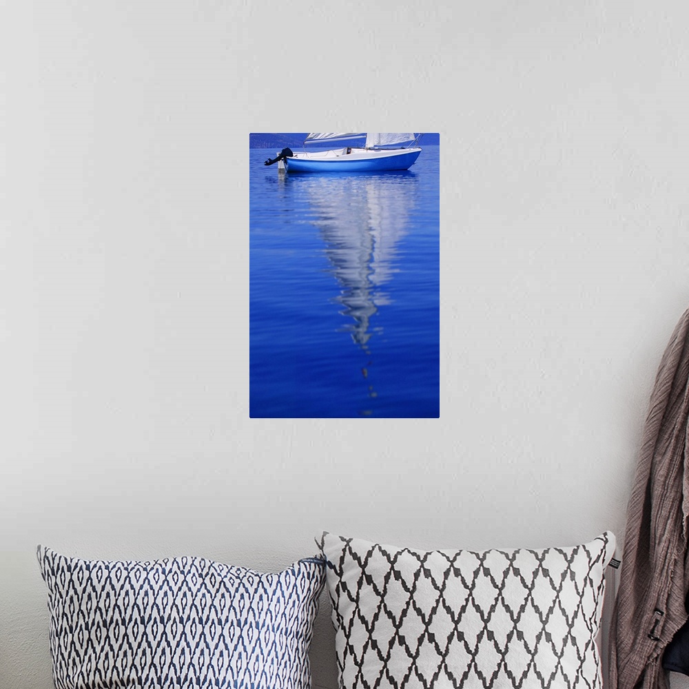 A bohemian room featuring Sailboat On Water