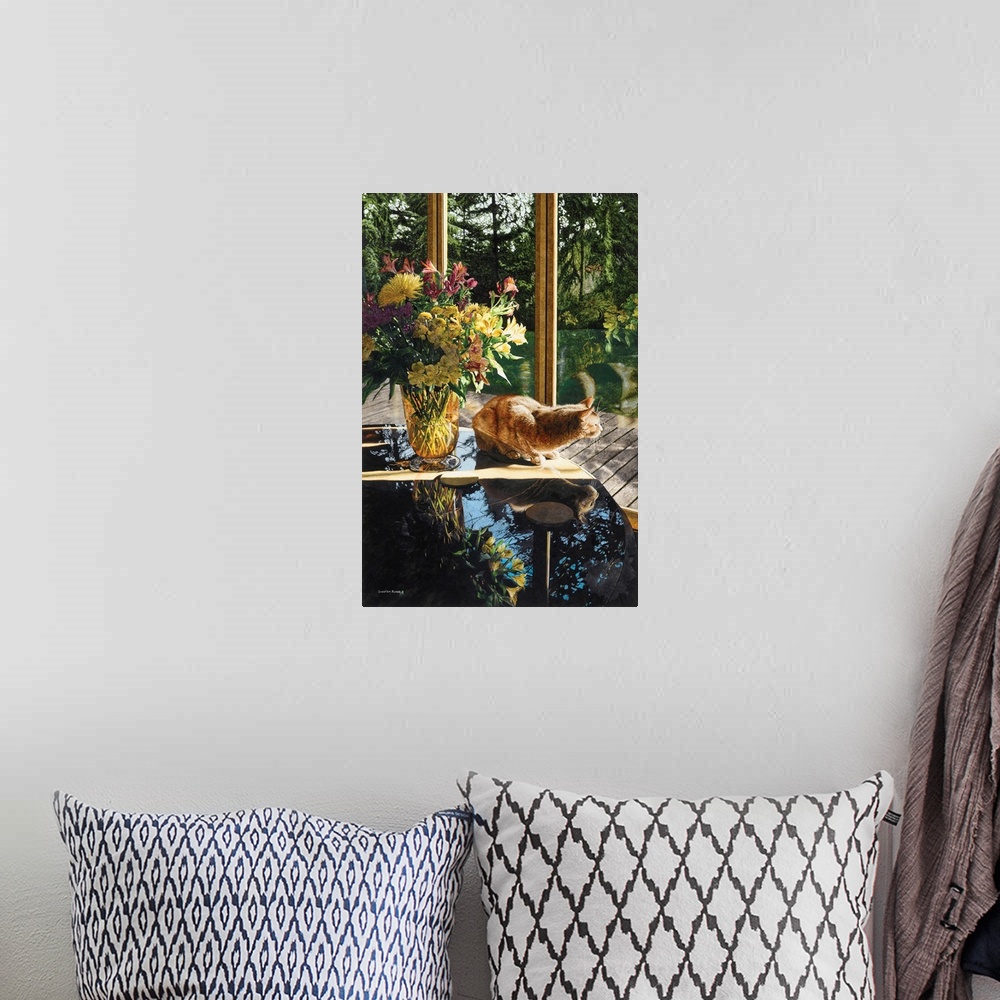 A bohemian room featuring A vertical image of a yellow tabby cat sitting on a table next to a vase of flowers will looking ...