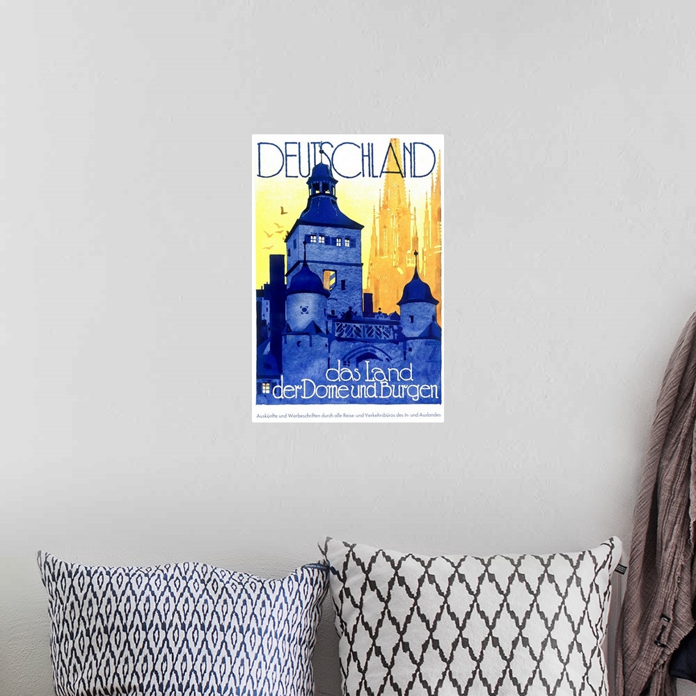 A bohemian room featuring Vintage poster of a large castle with text above and below it.