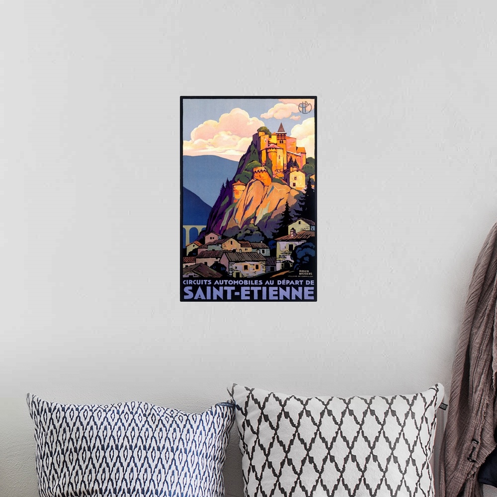 A bohemian room featuring Vintage travel poster depicting Saint Etienne and a castle high atop a mountain and cliff overloo...