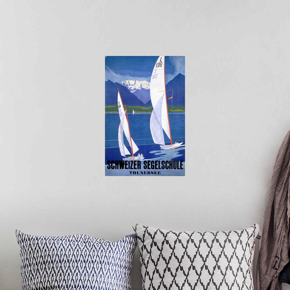 A bohemian room featuring Tall wall art of two sailboats sailing from left to right with layered mountains in the distance ...