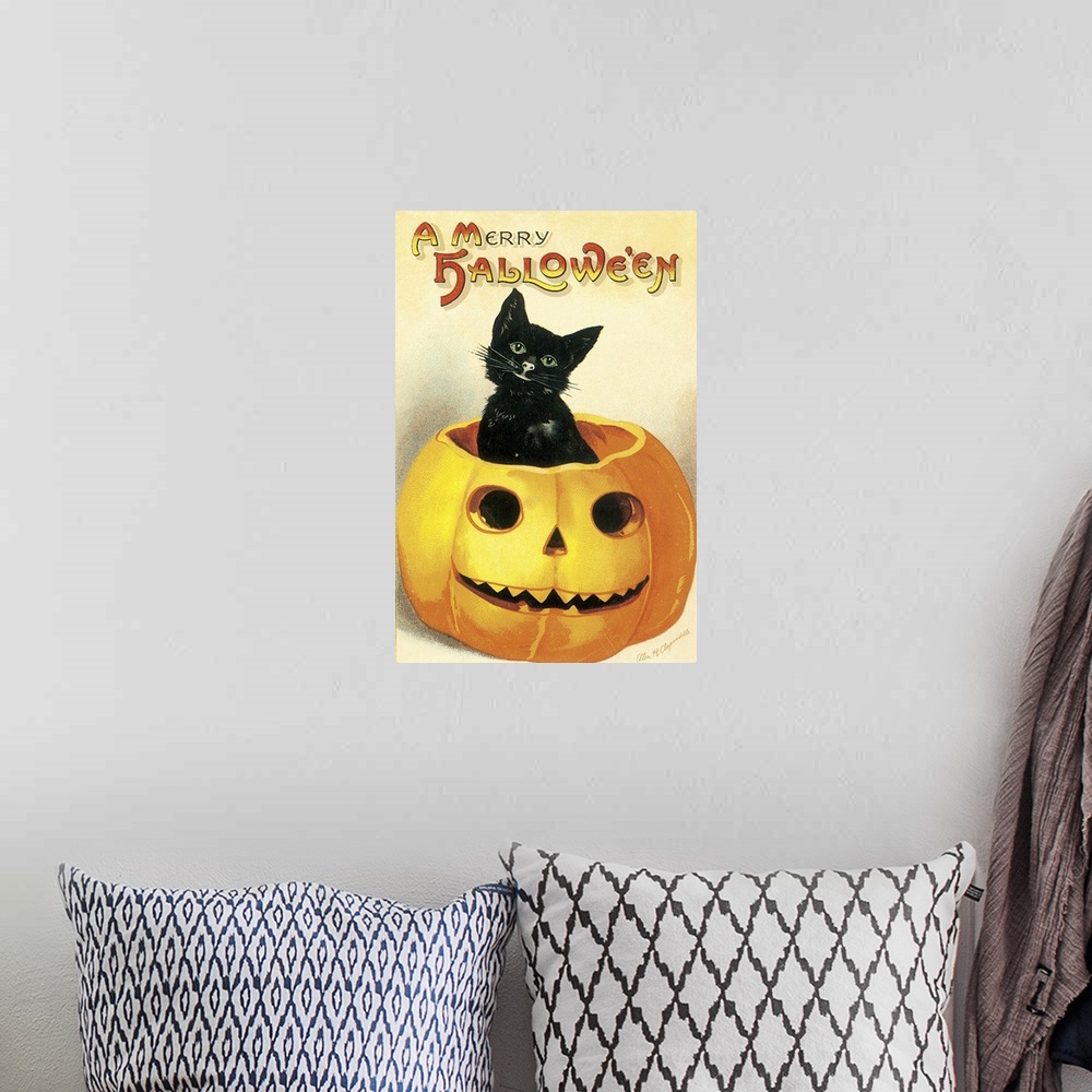 A bohemian room featuring A vintage illustration of a black kitten poking its head out from a smiling jack-o-lantern.