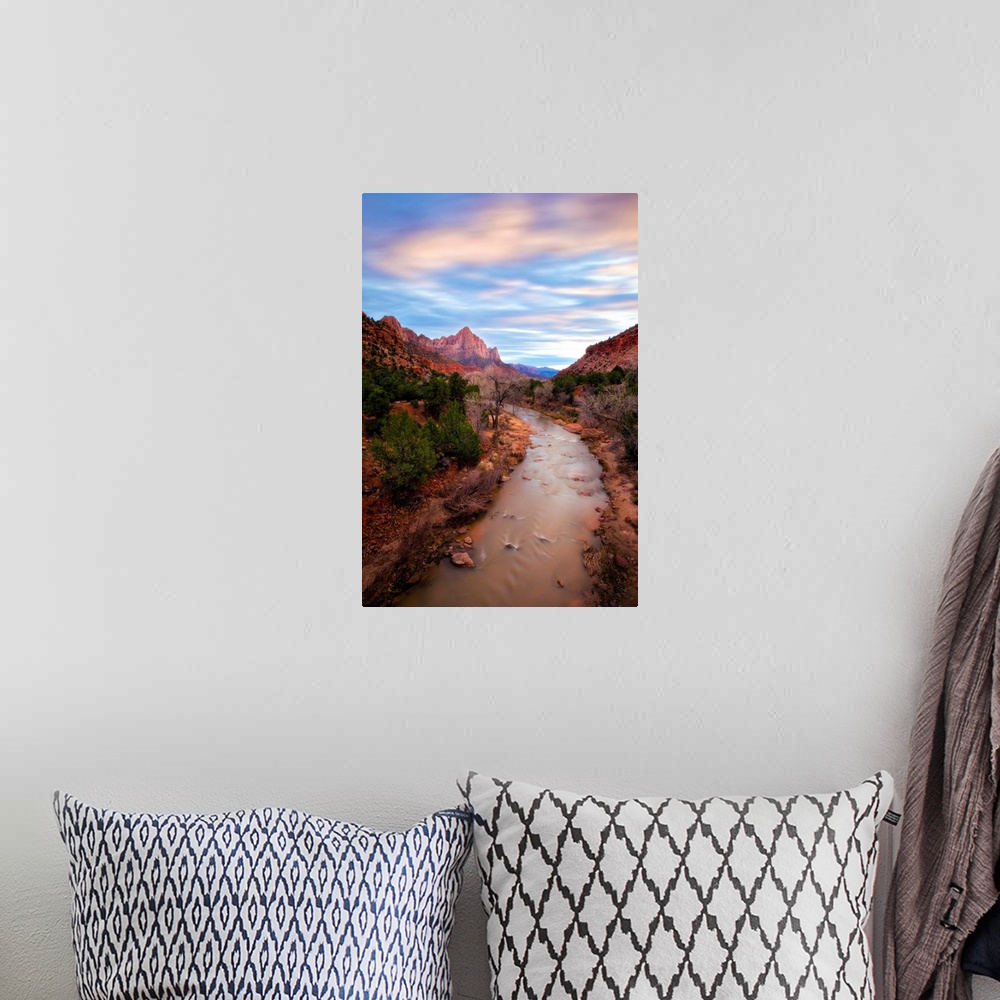 A bohemian room featuring A photograph of the Zion river in Zion National Park in Utah.