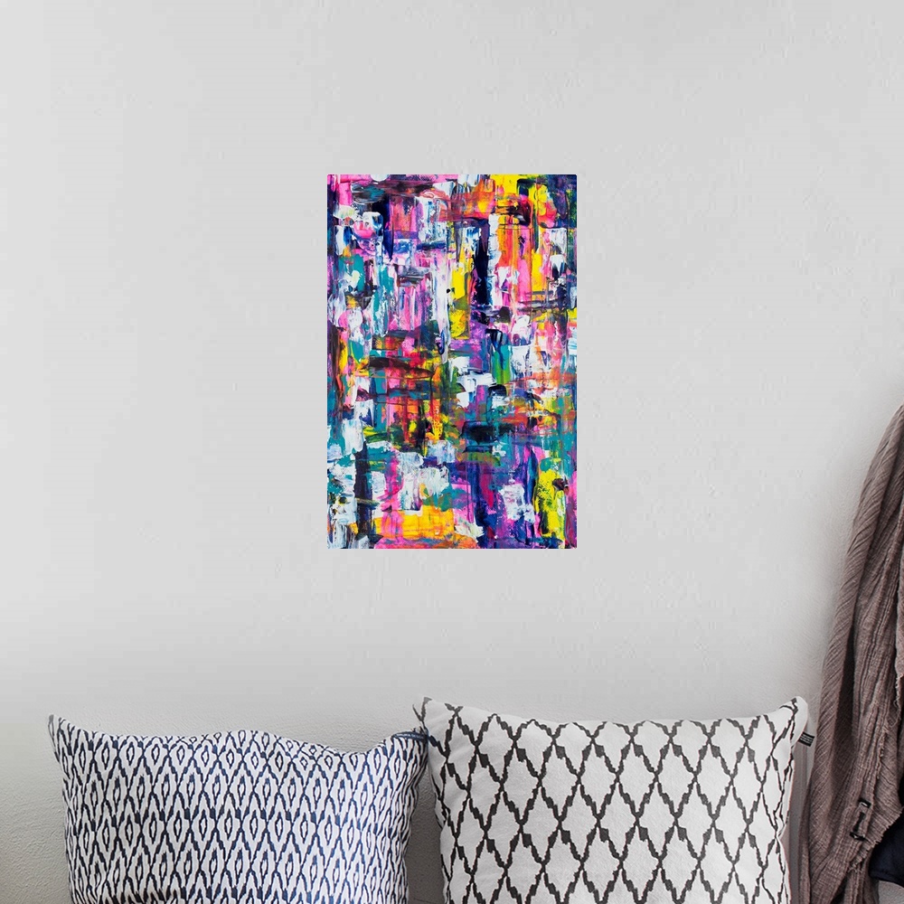 A bohemian room featuring Painting on paper of an assortment of playful colors.