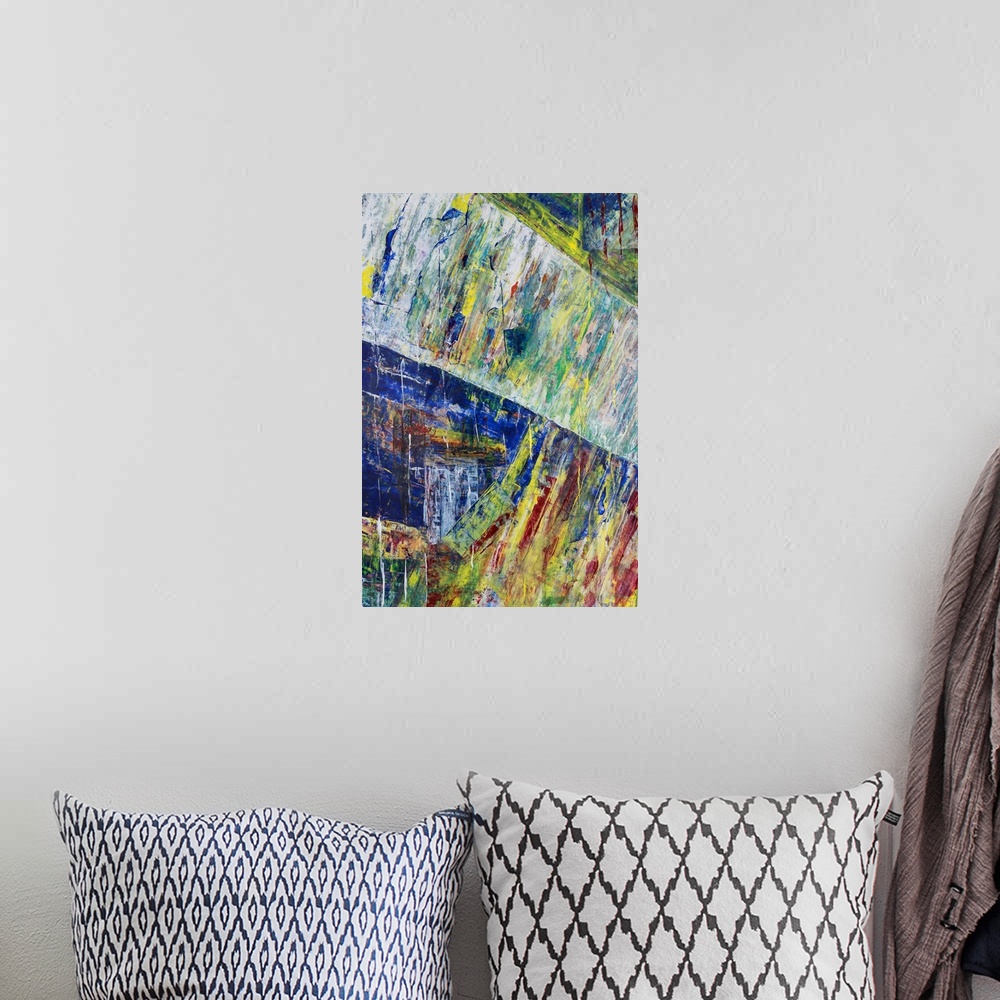 A bohemian room featuring Painting on paper of two vivid landscapes merging.