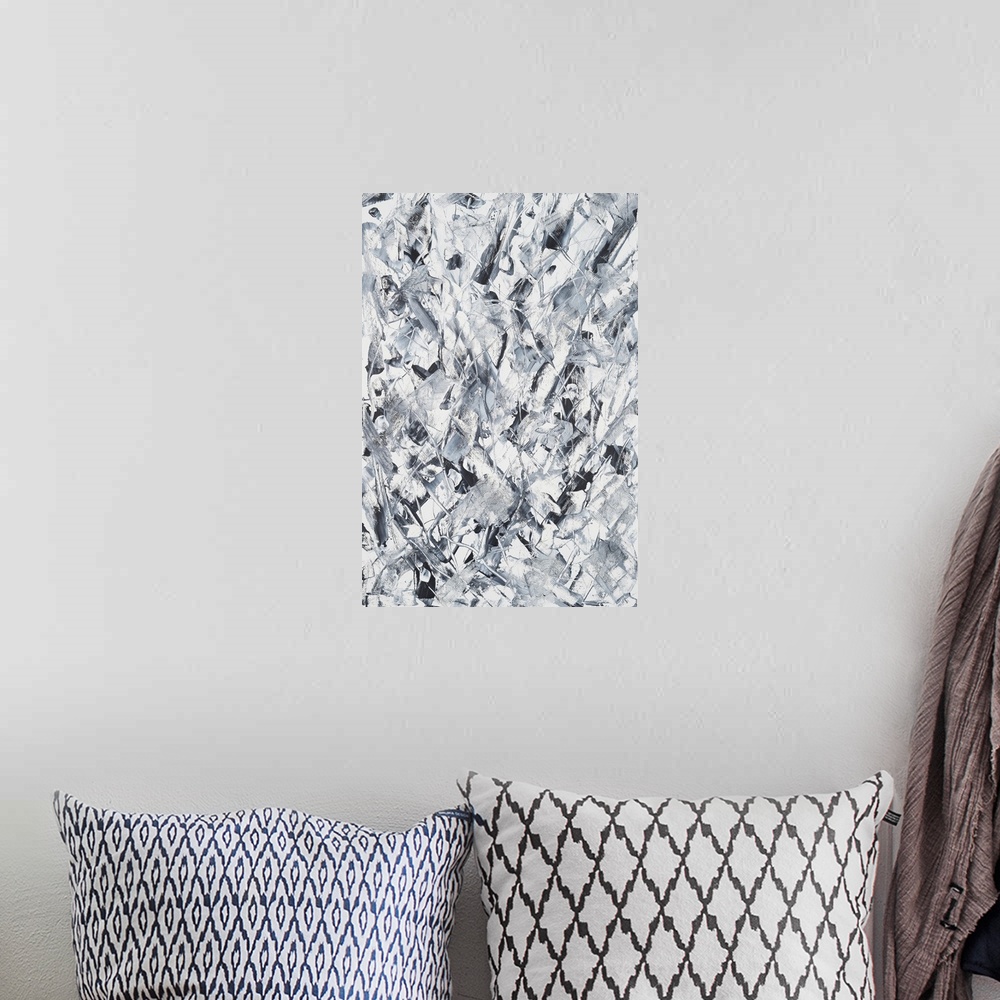 A bohemian room featuring Painting paper of grey geometrical shapes softened with delicate movement.