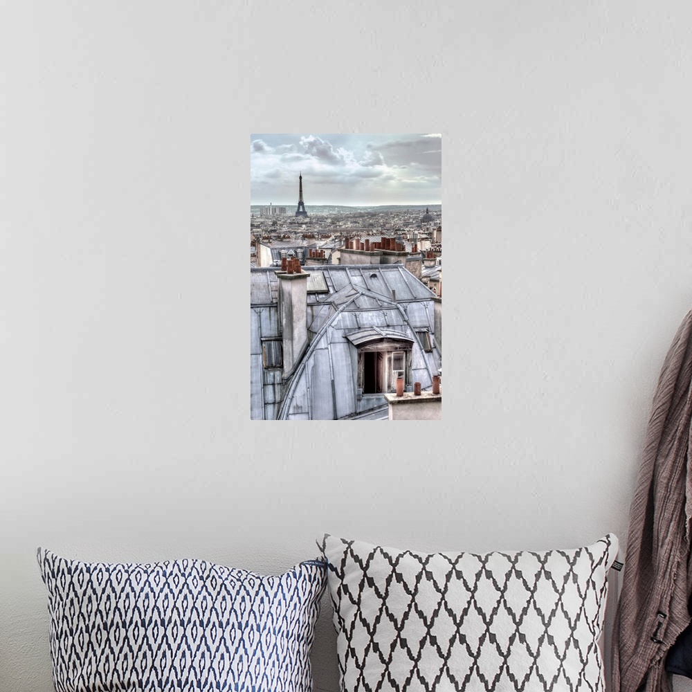 A bohemian room featuring Photograph of the roof tops of Paris, France with the Eiffel Tower in the distance.