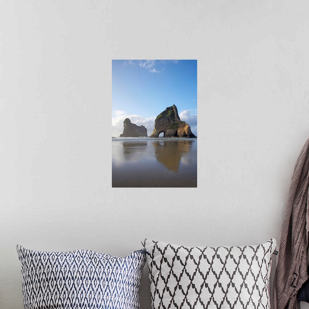A bohemian room featuring Archway Islands Reflected in Wet Sands of Wharariki Beach, near Cape Farewell, North West Nelson ...