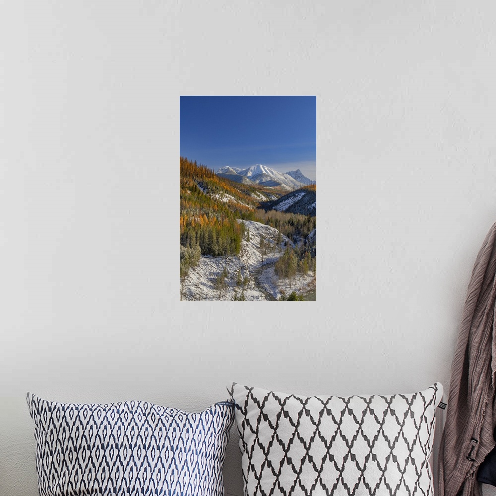 A bohemian room featuring Coal Creek with Cloudcroft Peaks in late autumn in Glacier National Park, Montana, USA.