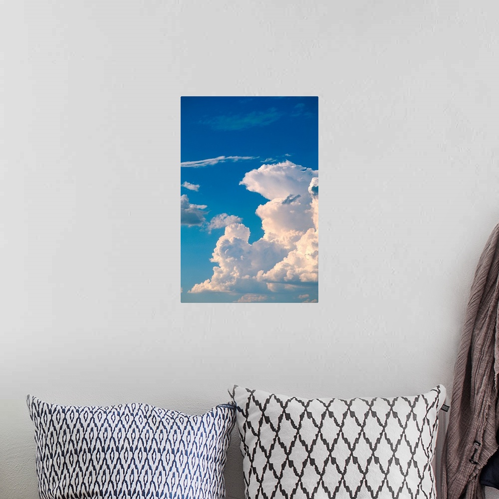 A bohemian room featuring Cumulus clouds in a blue sky.