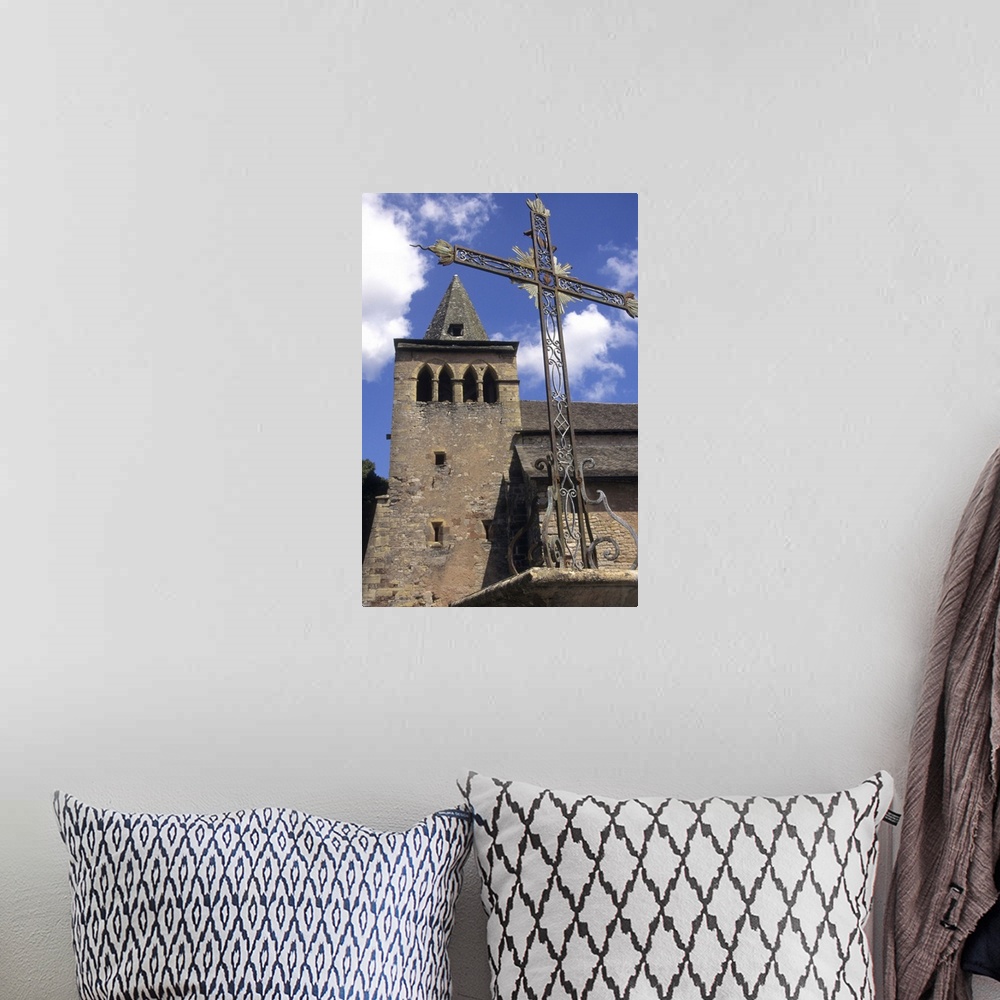 A bohemian room featuring France: Averyon, Bozouls, Eglise Ste Fauste, Romanesque 12th century, steeple and bell tower behi...