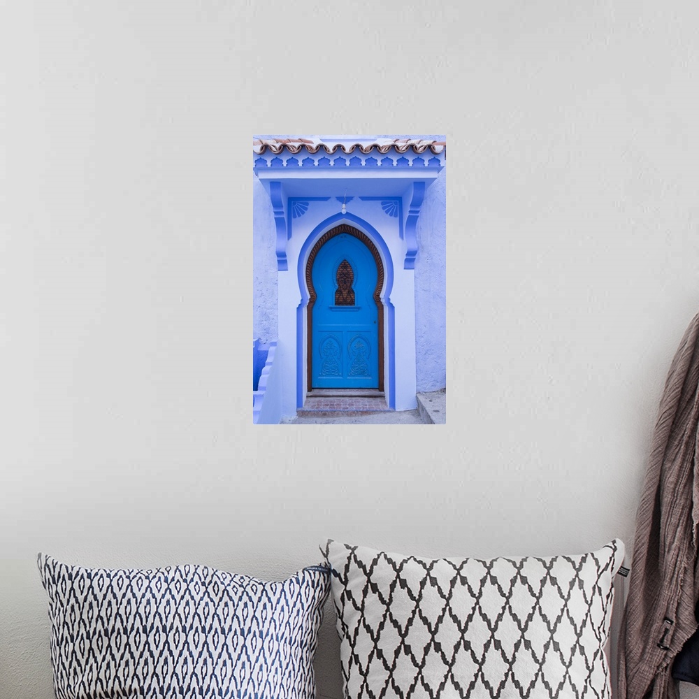 A bohemian room featuring Morocco, Chefchaouen. A traditional door and entrance to a home in the village.