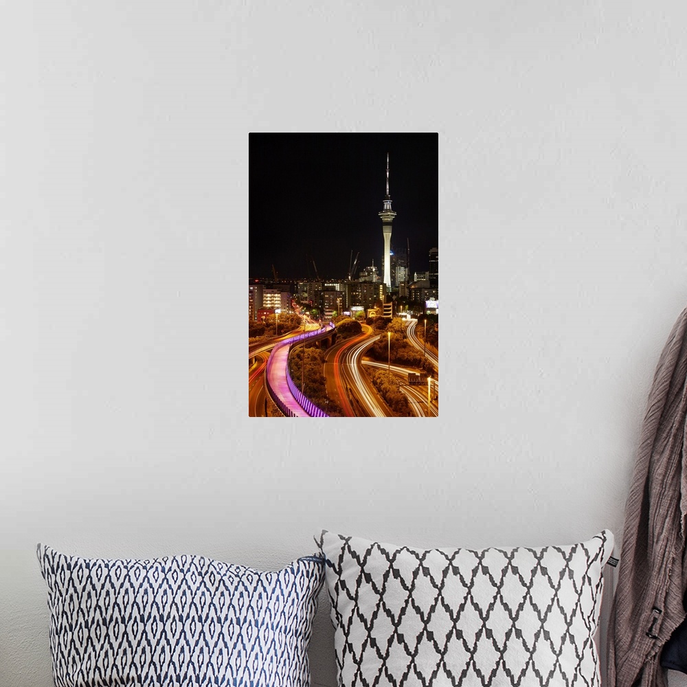 A bohemian room featuring Motorways, Light path cycleway, and sky tower at night, Auckland, North Island, New Zealand.