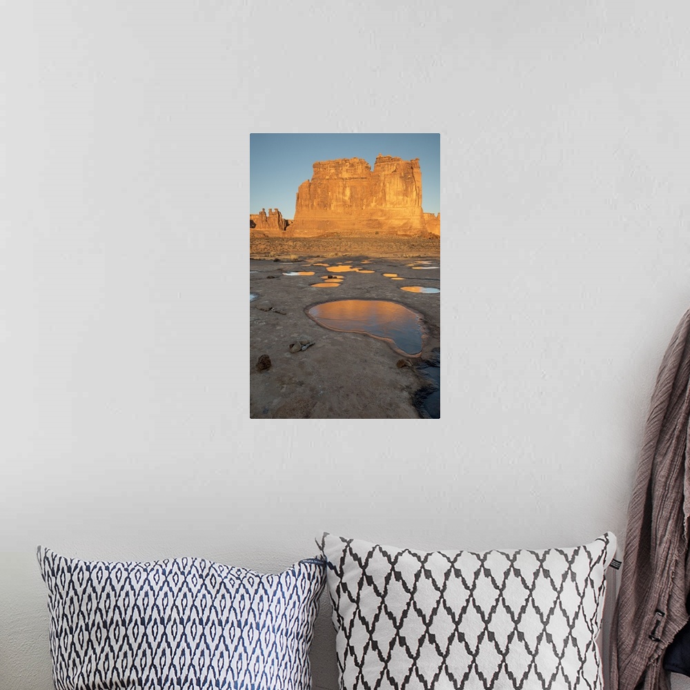 A bohemian room featuring North America, USA, Utah, Arches National Park.  Reflected light  from the Organ in icy pot holes...