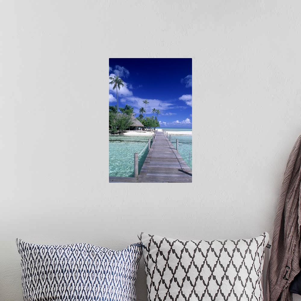 A bohemian room featuring The perfect scene of wooden dock walkway over water in beautiful Tahiti in Bora Bora, French Poly...