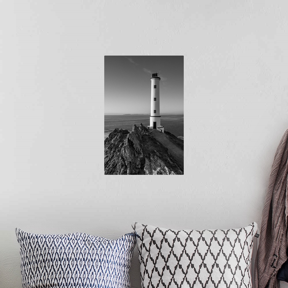 A bohemian room featuring Cabo home lighthouse, black and white.