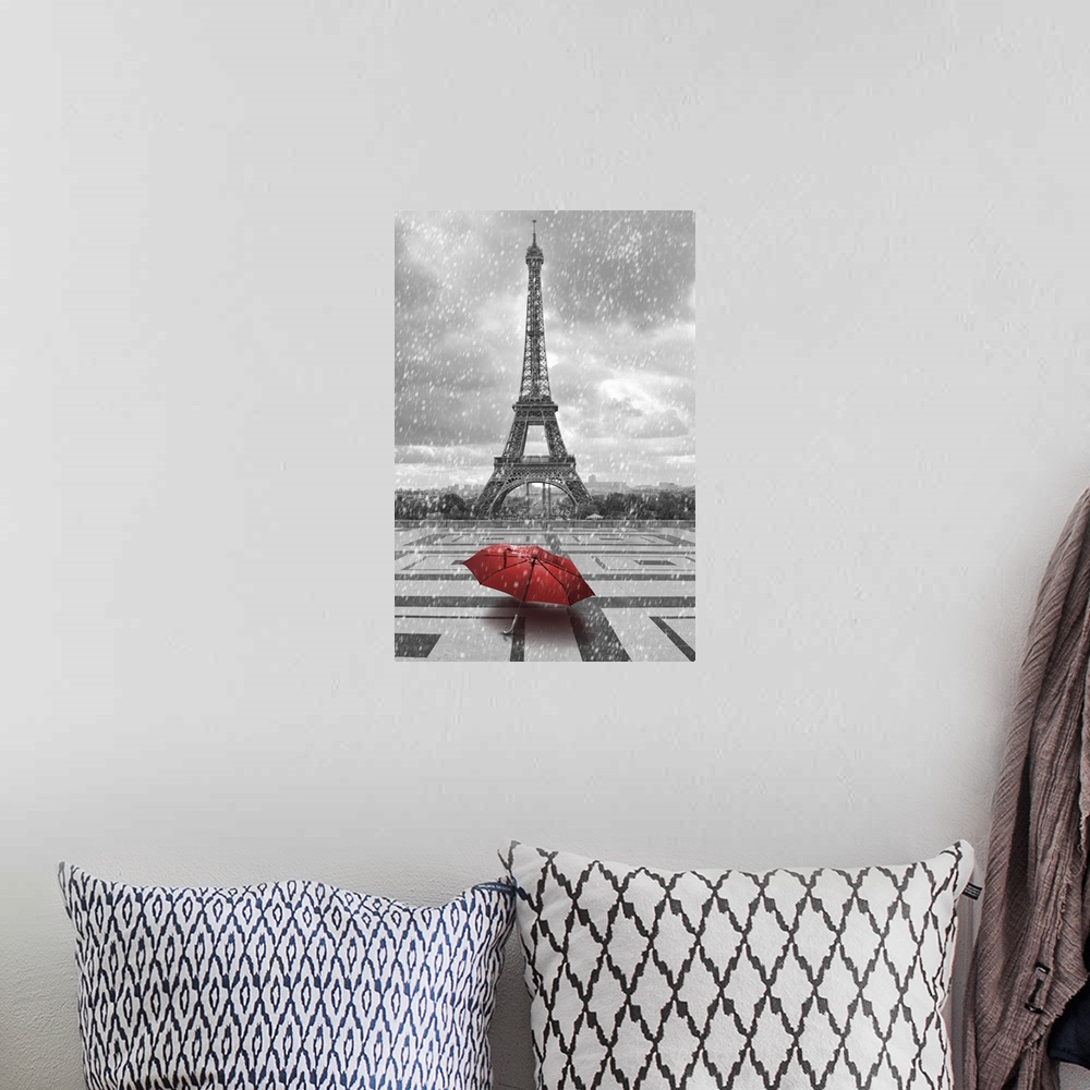 A bohemian room featuring Eiffel tower in the rain with red umbrella. Black and white photo with red element.