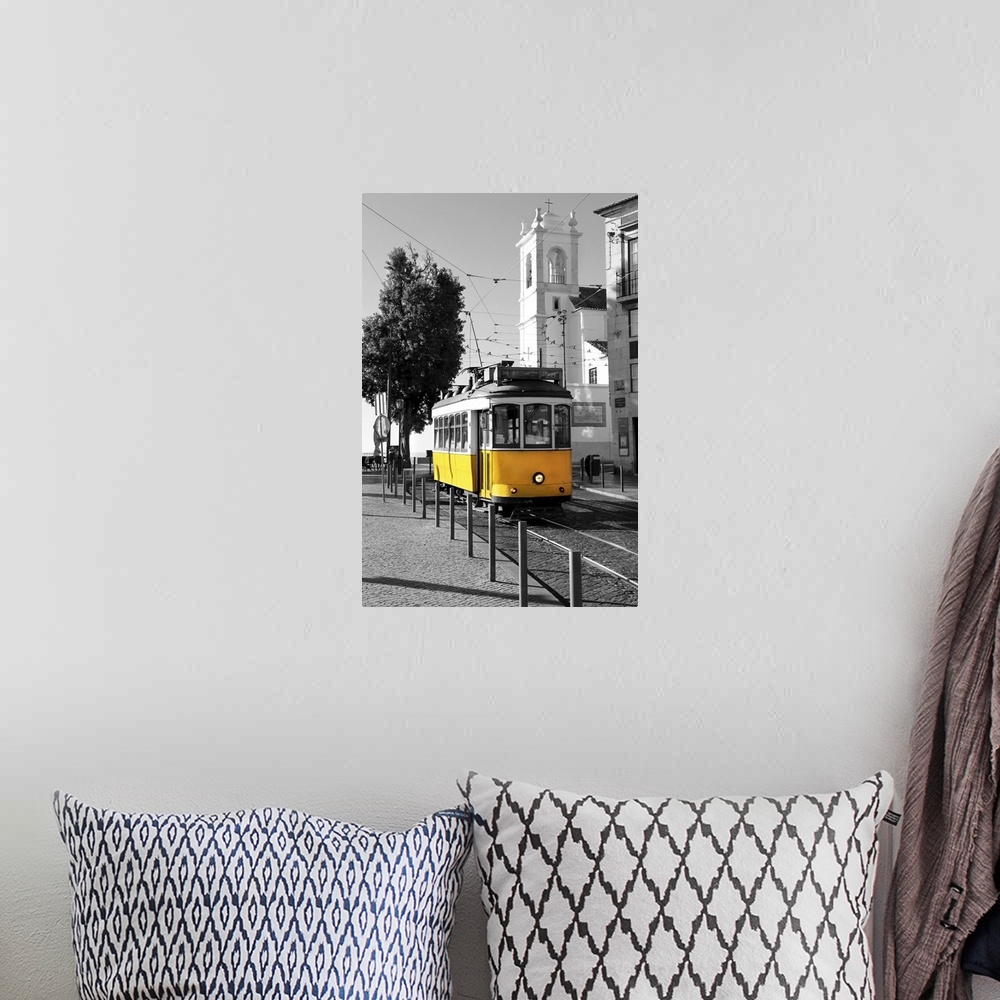 A bohemian room featuring Old yellow tram over black and white background in Lisbon, Portugal.