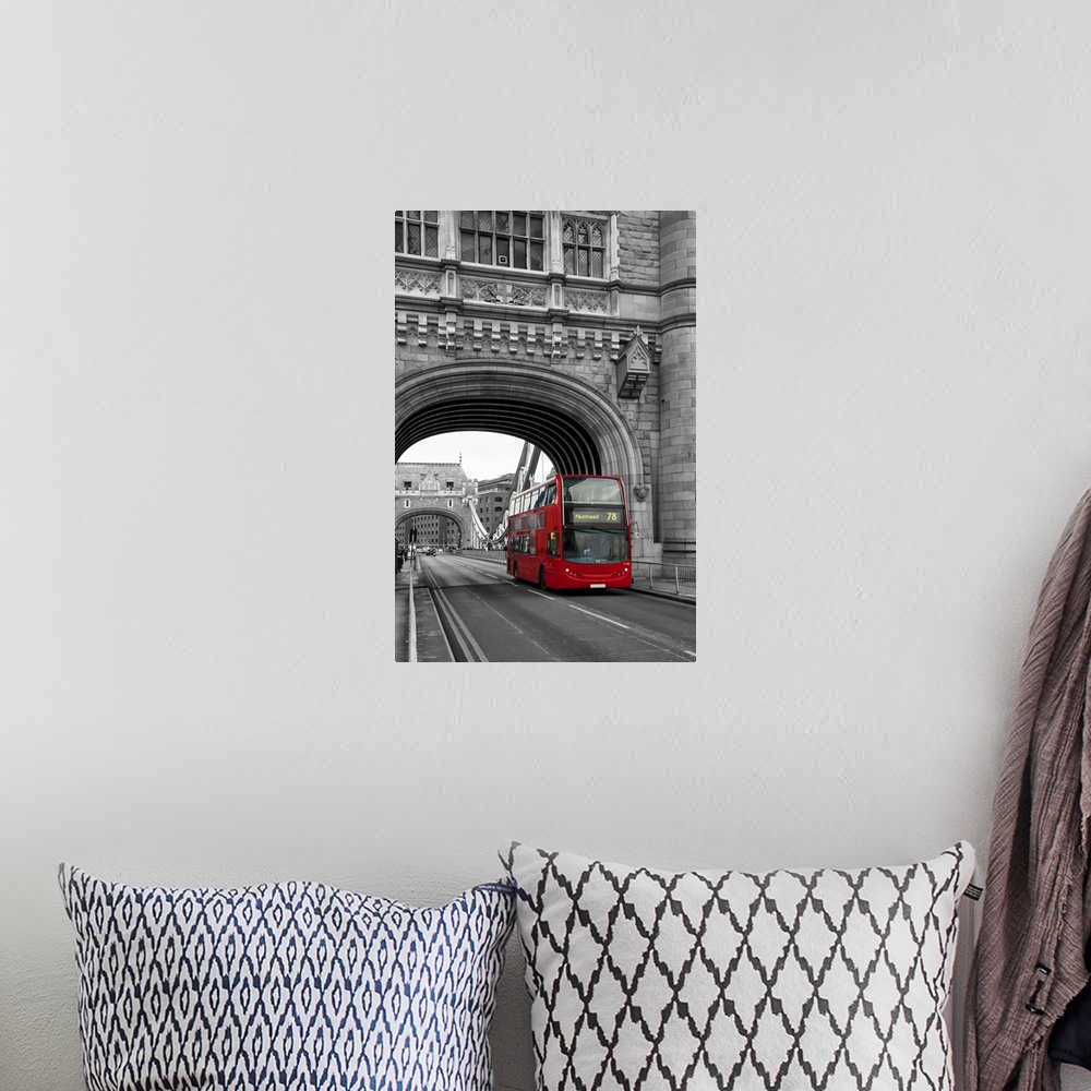A bohemian room featuring Red London bus passing over Tower Bridge in black and white with selective color.