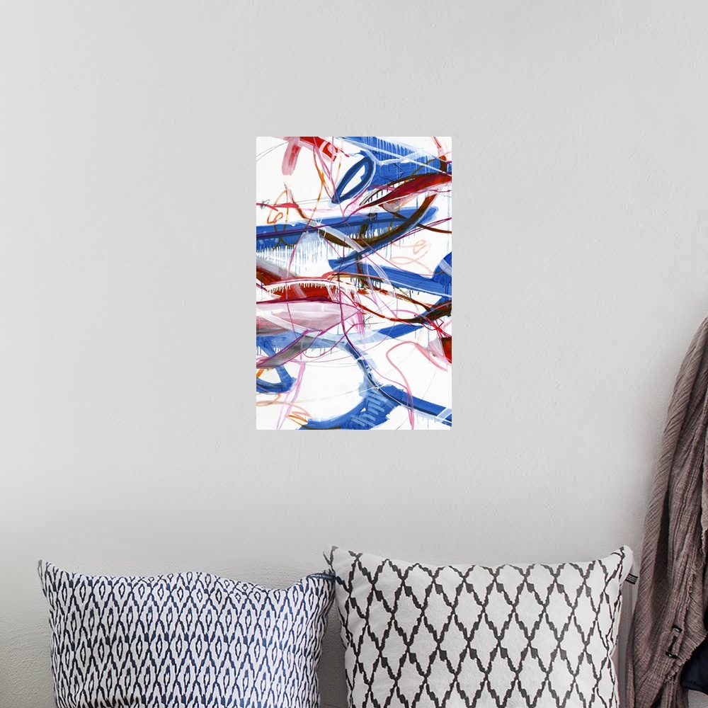 A bohemian room featuring Large abstract painting with red, blue, pink, orange, black, and white lines varying in size and ...