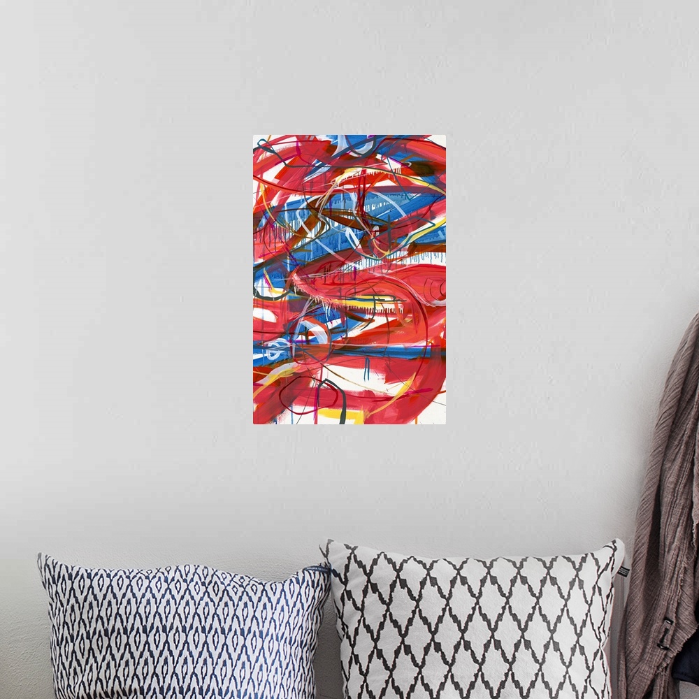 A bohemian room featuring Large abstract painting with red, blue, magenta, yellow, orange, and white lines varying in size ...