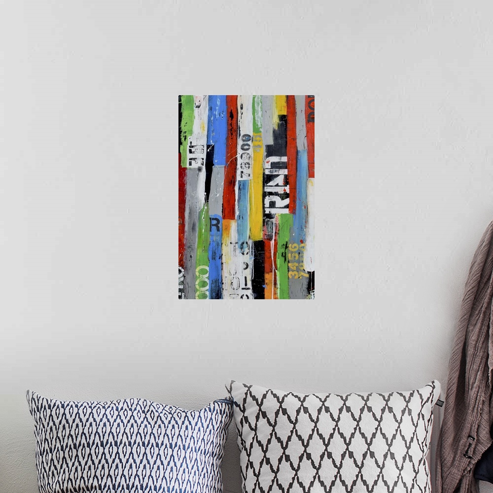 A bohemian room featuring A contemporary abstract painting using multiple colors and partially stenciled letters in vertica...
