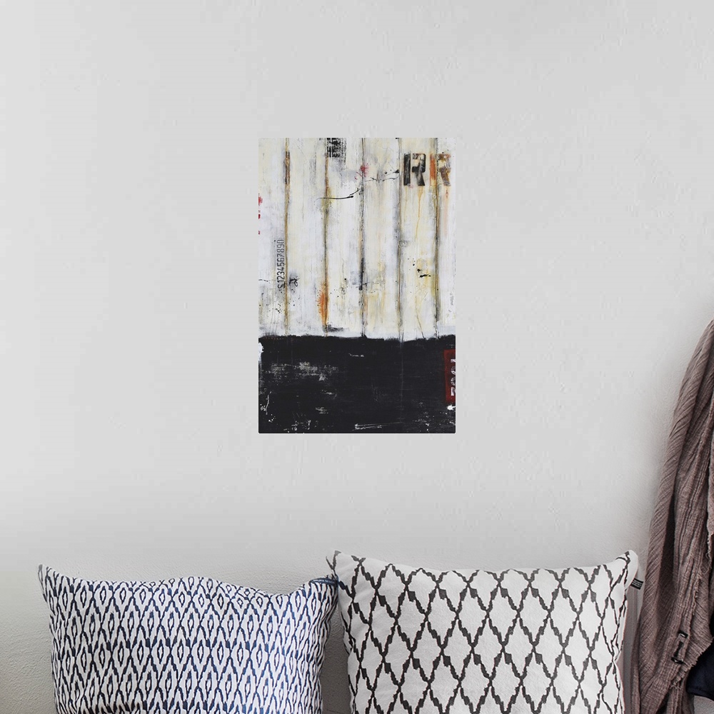 A bohemian room featuring Contemporary abstract painting using black and putty with stenciled letters.