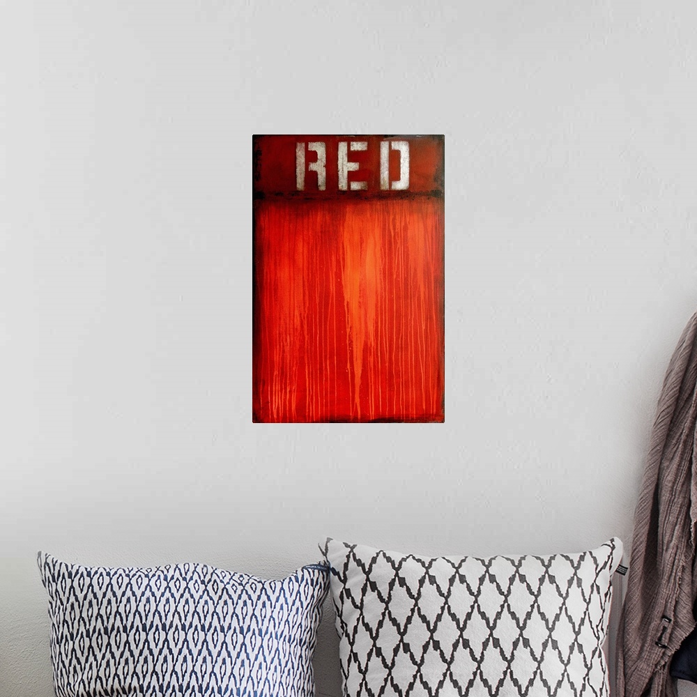 A bohemian room featuring Contemporary abstract art created in shades of red with paint drips and the word 'Red' stenciled ...
