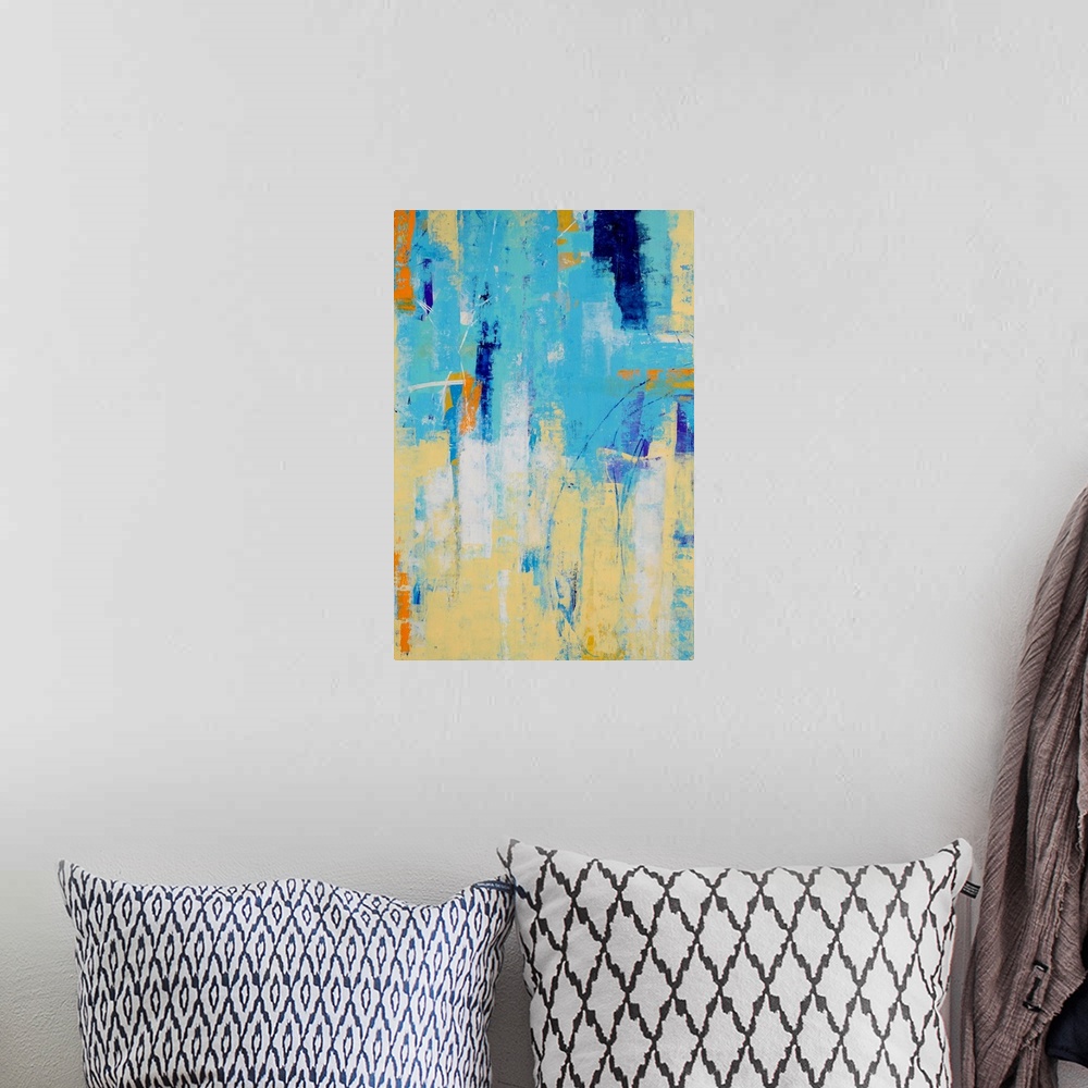 A bohemian room featuring A contemporary abstract painting using light blue and a pale yellow merging together.