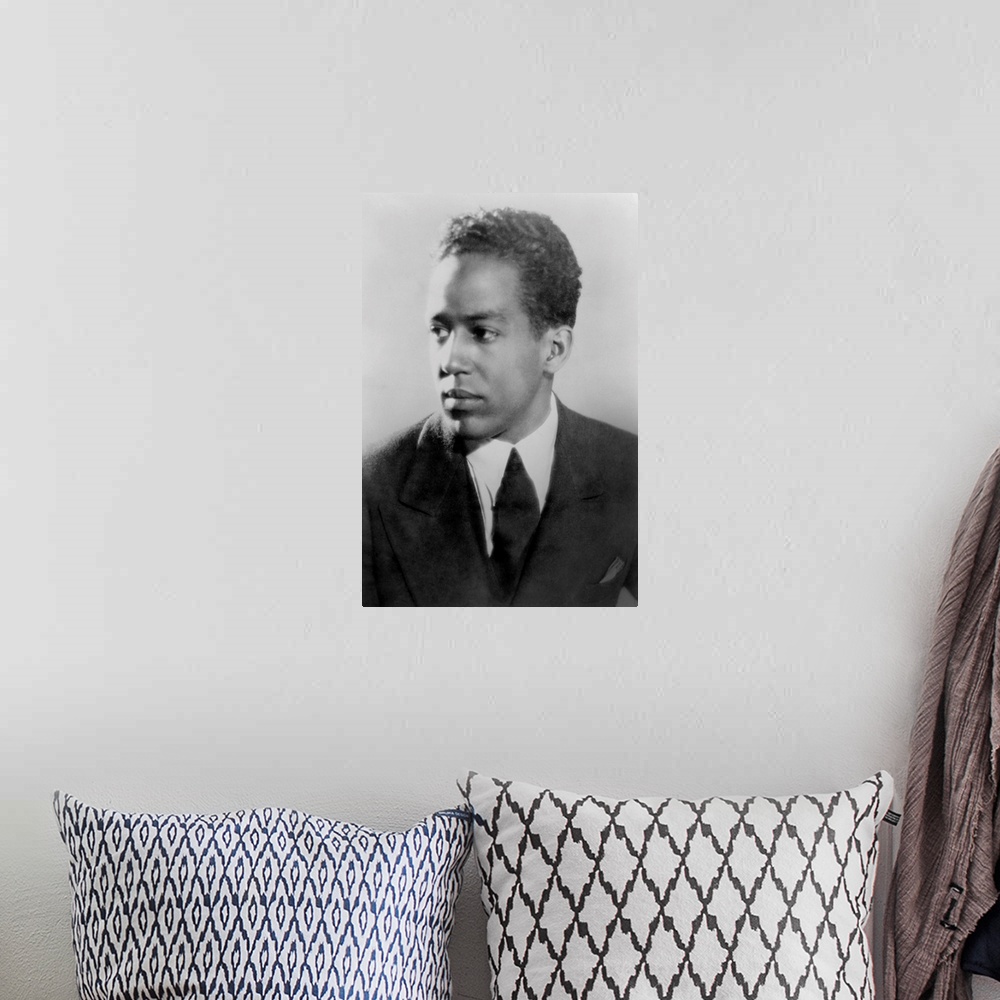 A bohemian room featuring Langston Hughes, African American poet, novelist, playwright, and journalist, ca. 1930.