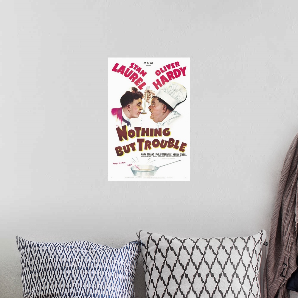 A bohemian room featuring Nothing but Trouble - Vintage Movie Poster