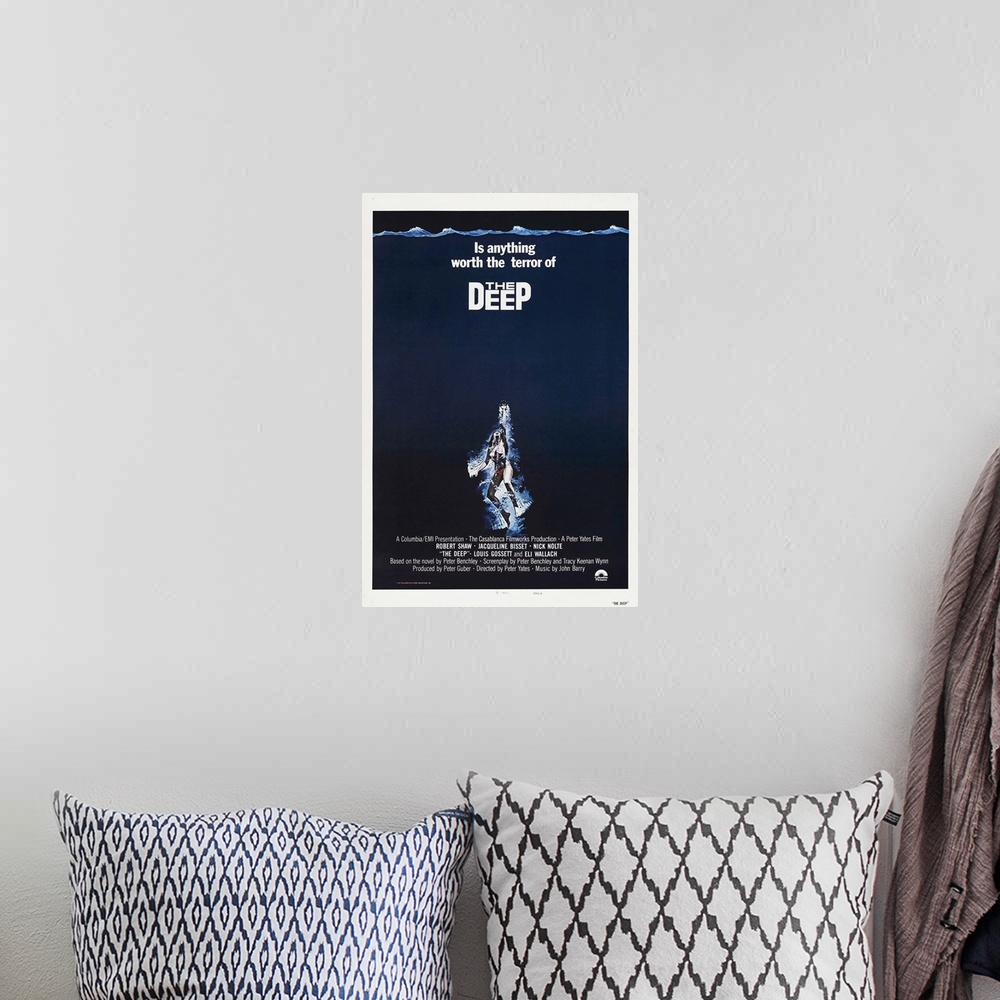 A bohemian room featuring The Deep - Vintage Movie Poster