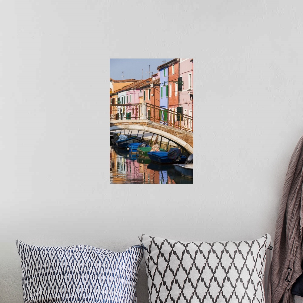 A bohemian room featuring Italy, Burano. Reflection of colorful houses in canal.