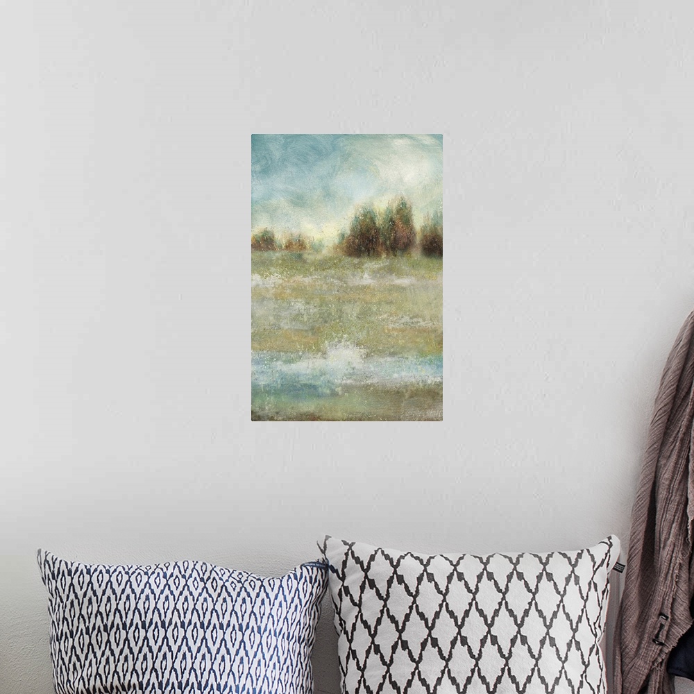 A bohemian room featuring Vertical abstract landscape painting of a meadow with trees lining the horizon.