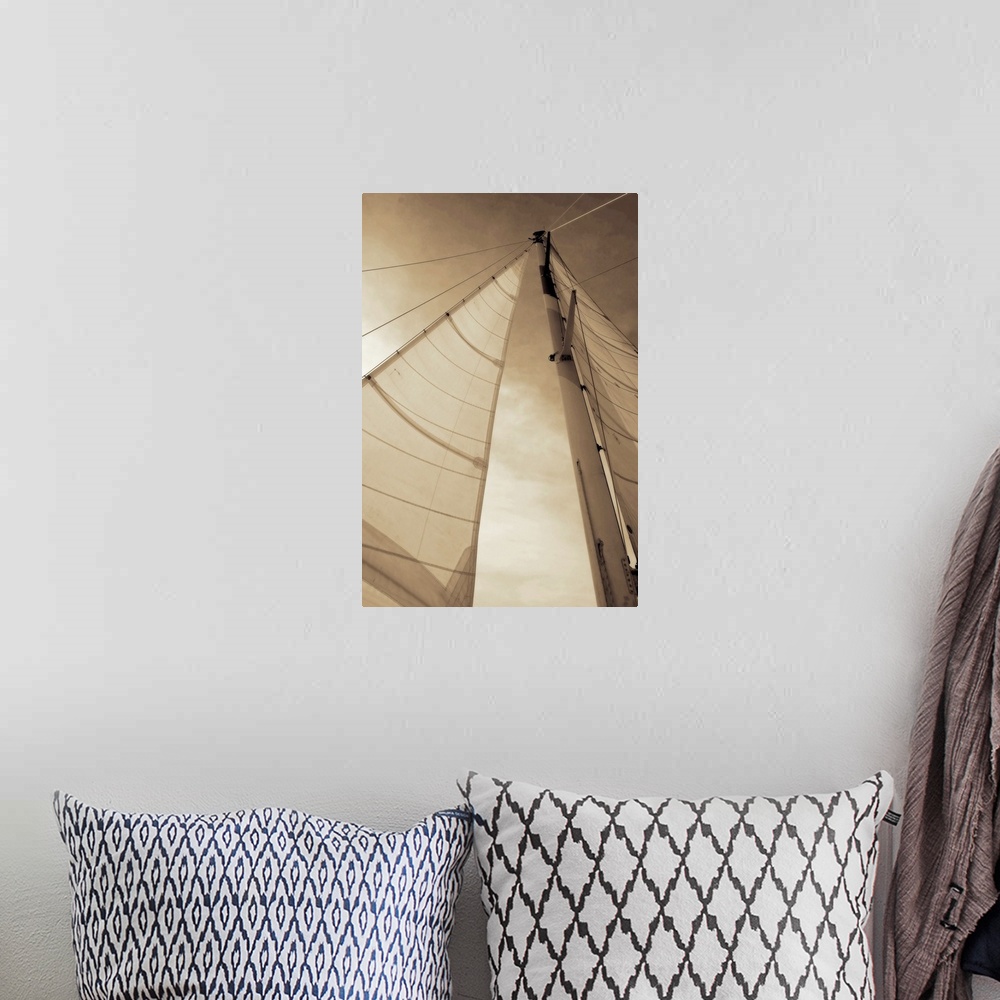 A bohemian room featuring Vertical, low angle photograph, looking up large sails as the sun shines through them, against a ...