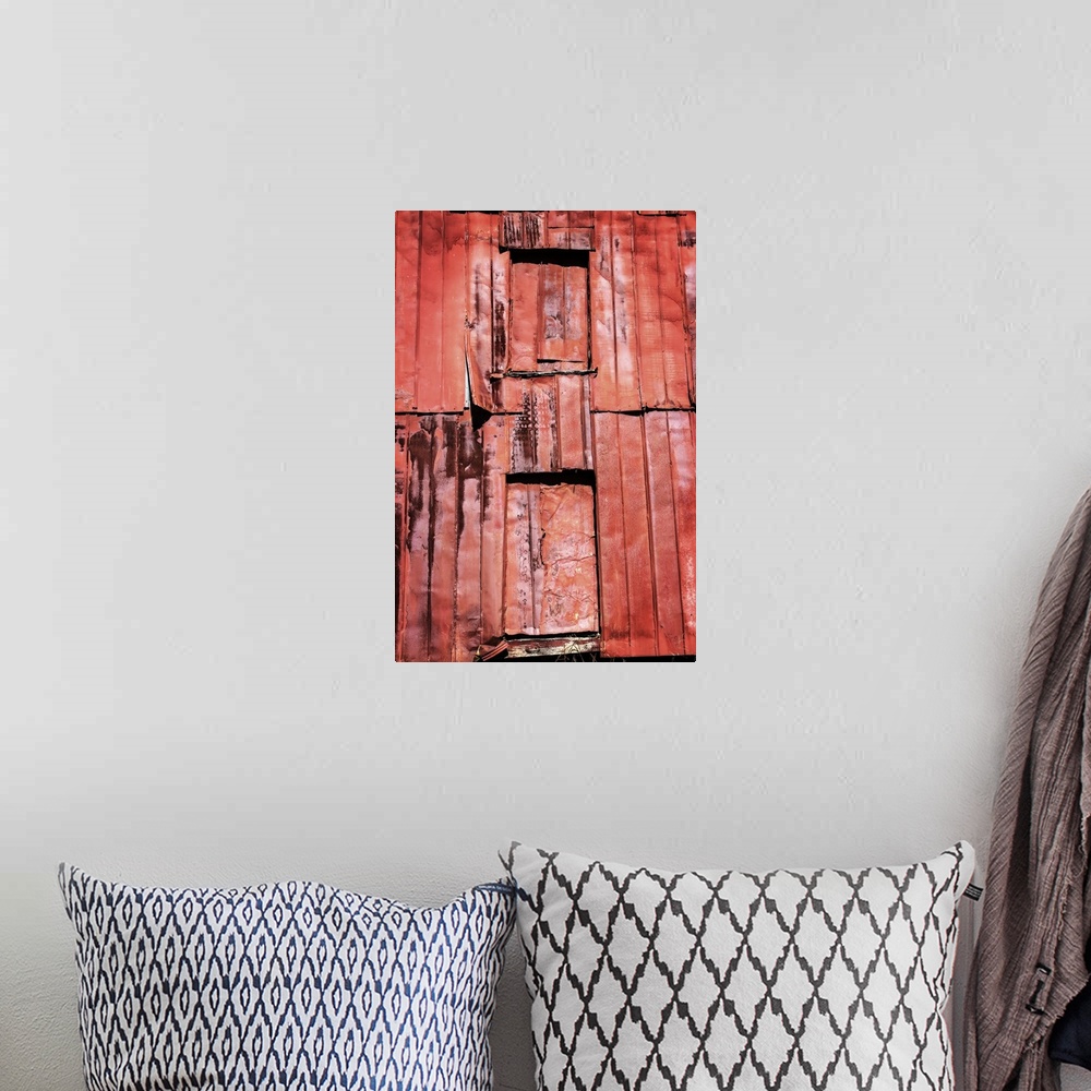A bohemian room featuring Photograph of a weathered farm building, taking up the whole frame.