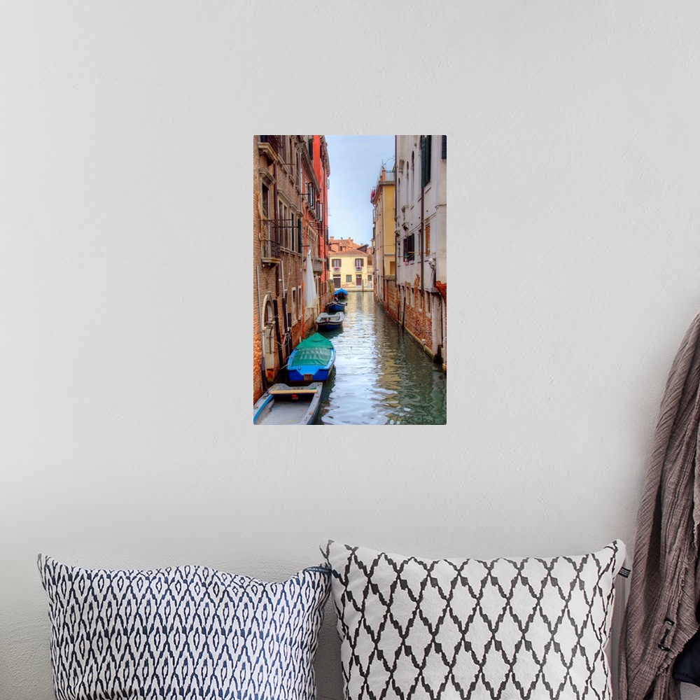 A bohemian room featuring HDR photograph of a canal flowing through the alleys of Venice, Italy, with small boats floating ...
