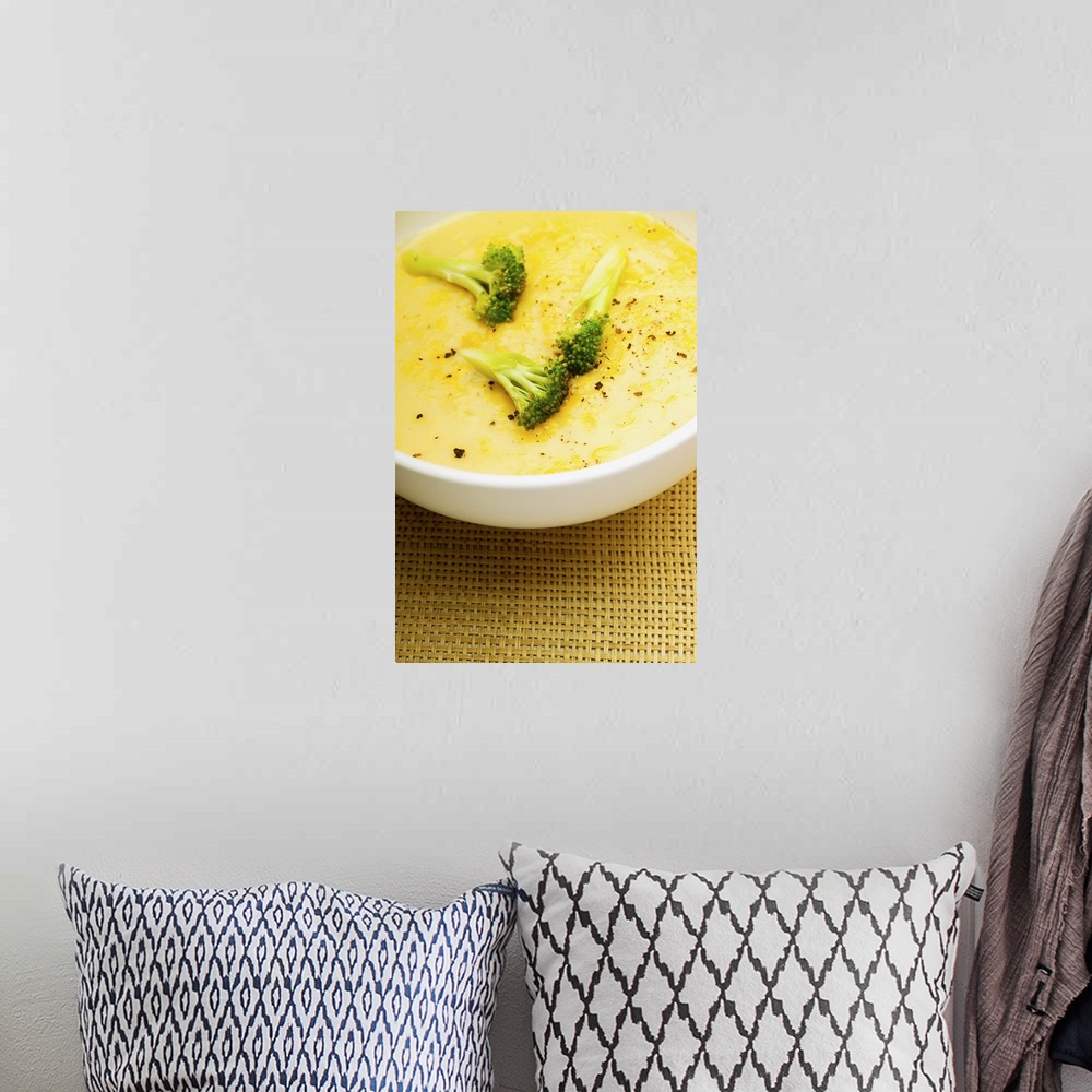 A bohemian room featuring Bowl of broccoli soup, close-up